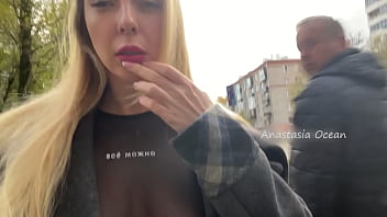 A Girl Shows Her Breasts While Walking In Public In The City free video